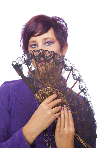 美丽的时尚模特拿着一把扇子图片下载