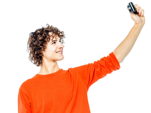 拿着相机拍人像的年轻人图片下载