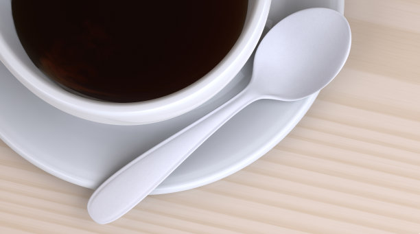 特写咖啡杯和勺子在现代木材背景图片下载