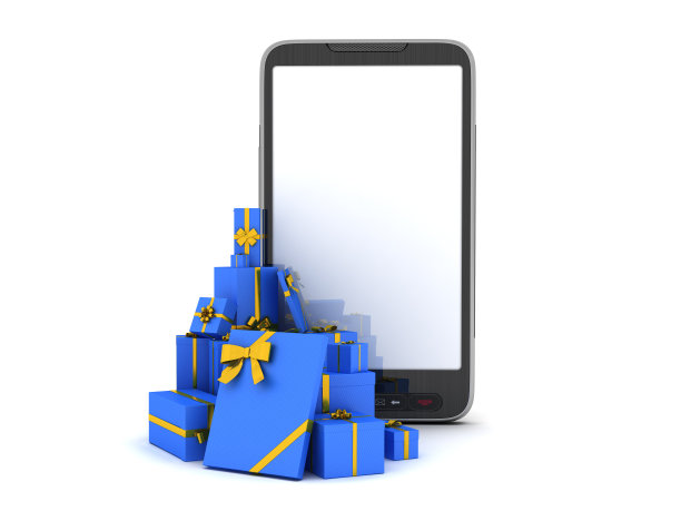 白色背景上的圣诞礼物和手机图片下载