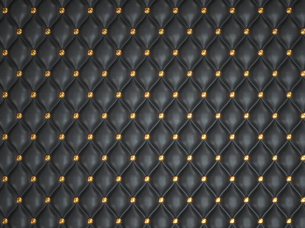 黑色皮革背景与金色按钮图片下载