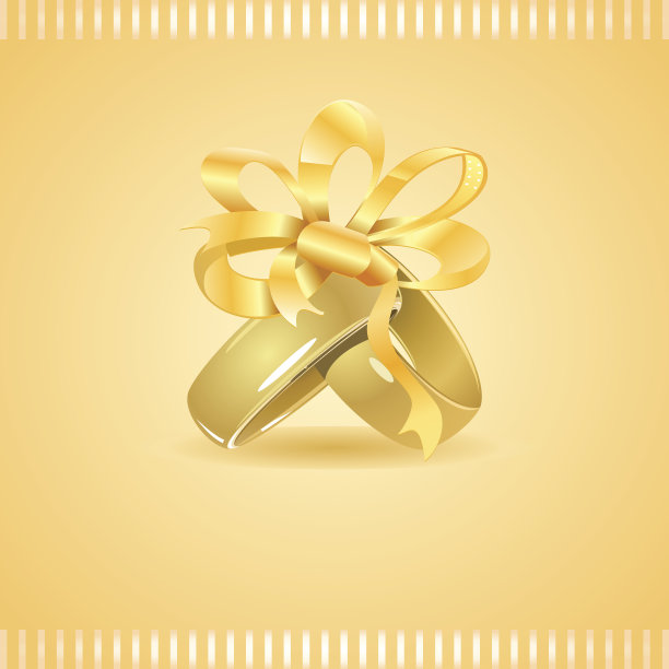 两个用丝带系着的金结婚戒指图片下载