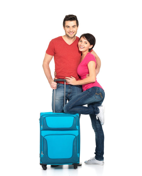 一对带着箱子去旅行的夫妇图片下载