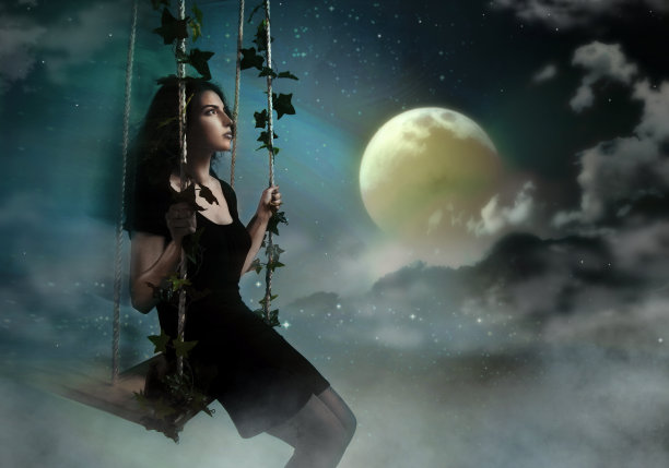 美丽的黑发荡秋千在夜晚的天堂图片下载