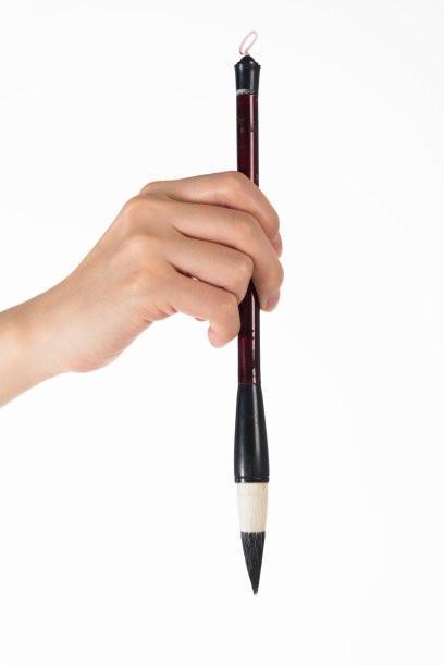 男人手中的毛笔图片下载