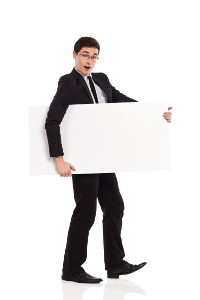惊讶的商人带着标语走。图片下载