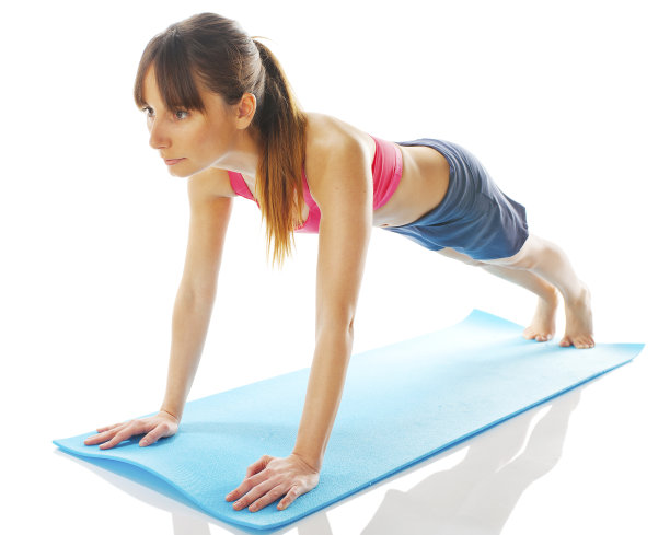 年轻的健身女性做普拉提锻炼图片下载