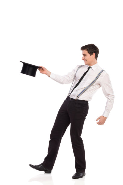 拿着大礼帽的魔术师。图片下载