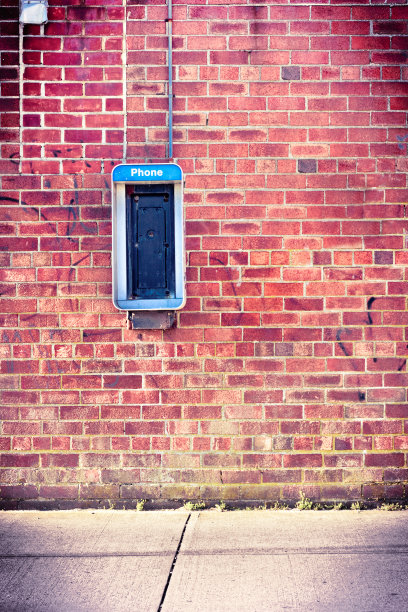 带有付费电话的砖墙图片下载