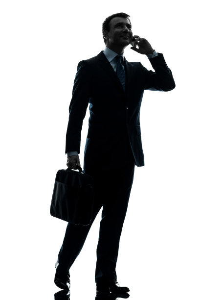 商人走在电话旁的剪影图片下载