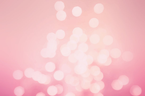 抽象灯光与散景节日背景。粉色和金色图片下载