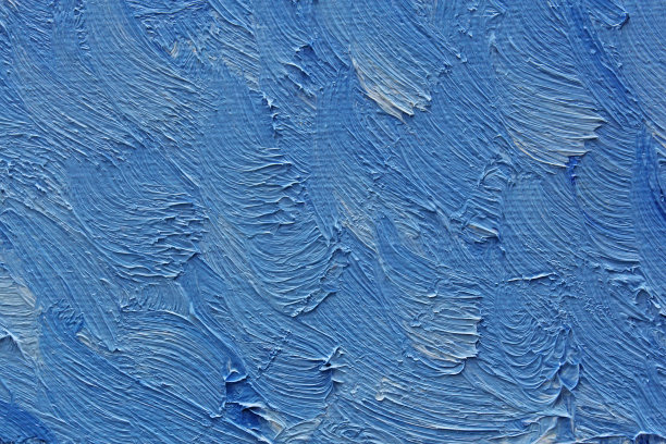 色彩斑斓的画笔在画布上画油画图片下载