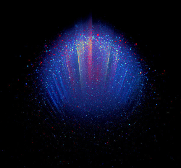 不同颜色的颜料在光线照射下滴在黑色上图片下载