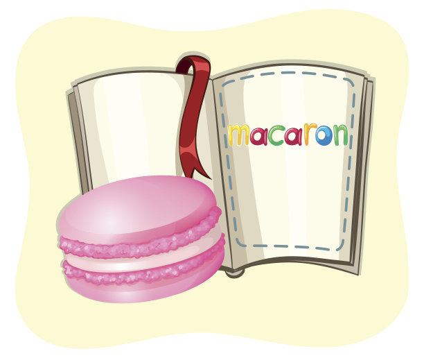 粉红色的马卡龙和一本书图片下载