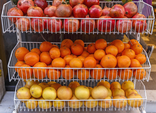 出售石榴、苹果和桔子图片下载