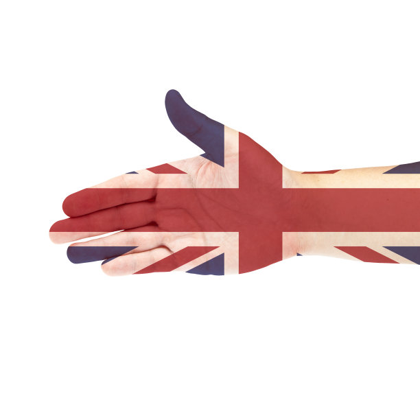 手上的英国国旗被孤立在白色背景上图片下载