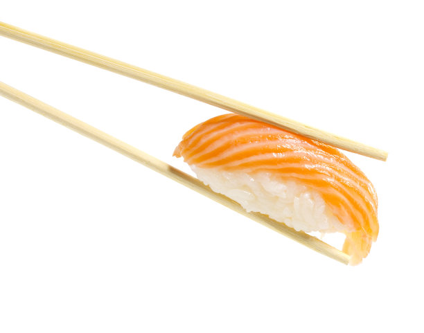 三文鱼寿司手握寿司在筷子孤立在白色的背景图片下载