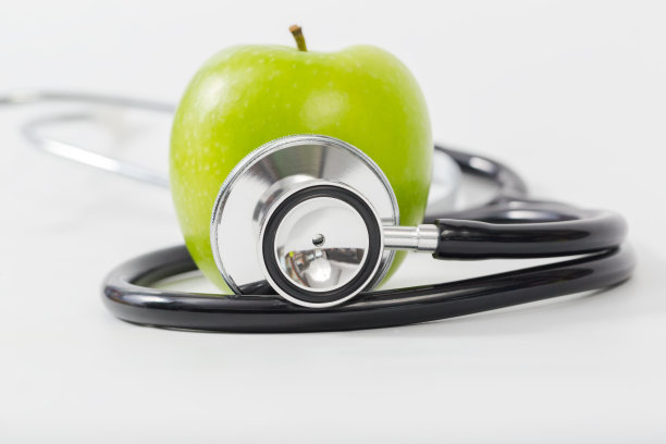 健康生活理念，医疗听诊器为健康和苹果图片下载