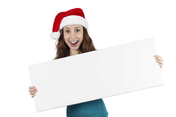 圣诞健身女人与一个惊讶的表情持有空白的广告牌图片下载