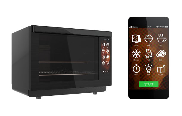 电烤箱和智能手机隔离在白色背景图片下载