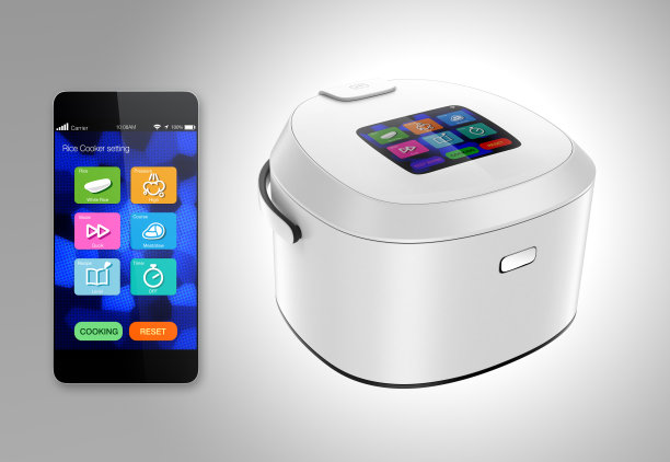 电饭煲和智能手机孤立在灰色背景图片下载
