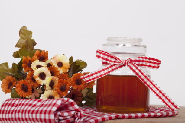 蜂蜜在罐子里，背景很亮图片下载