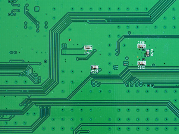 一个绿色印刷电脑电路板的特写图片下载