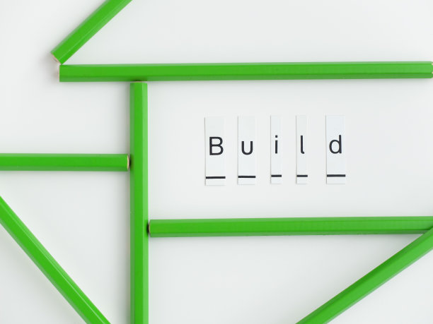 “建立”字与铅笔在白色背景。图片下载