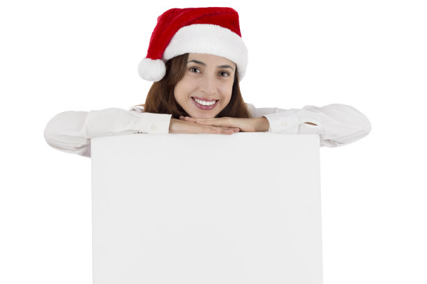 圣诞女商人靠在空白的广告牌上图片下载