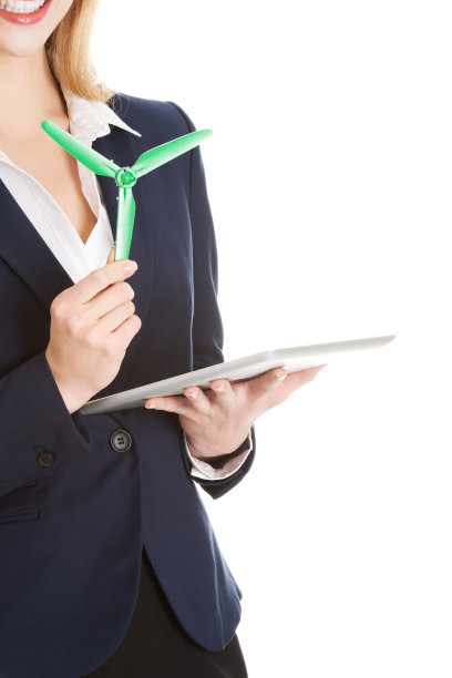 美丽的白人商人女人拿着风车和平板。图片下载