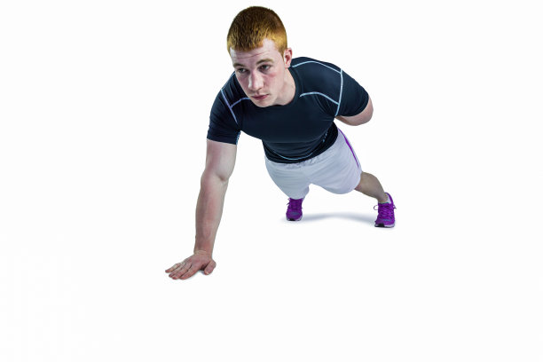 肌肉发达的橄榄球运动员做单手俯卧撑图片下载