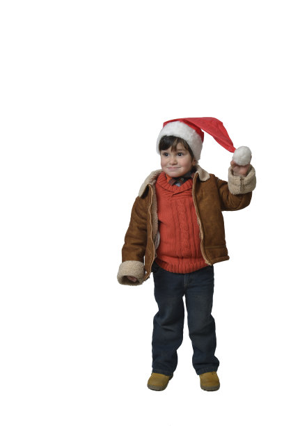 男孩带着可爱的微笑拿着圣诞帽图片下载