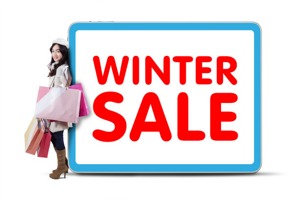 女购物狂靠在冬季特价文图片下载