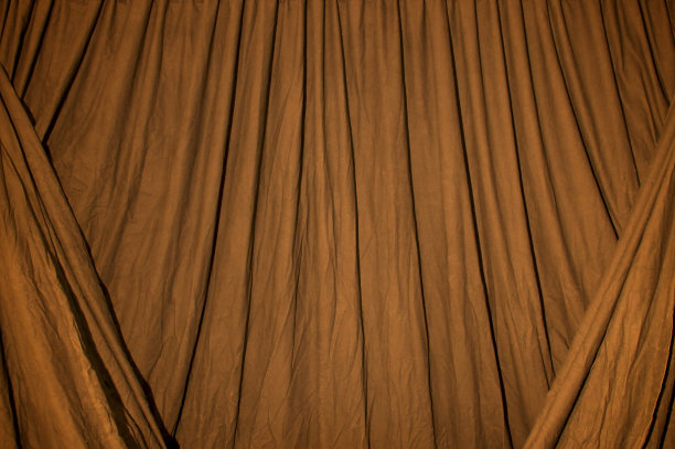 黑色的背景布与橙色的凝胶照明图片下载