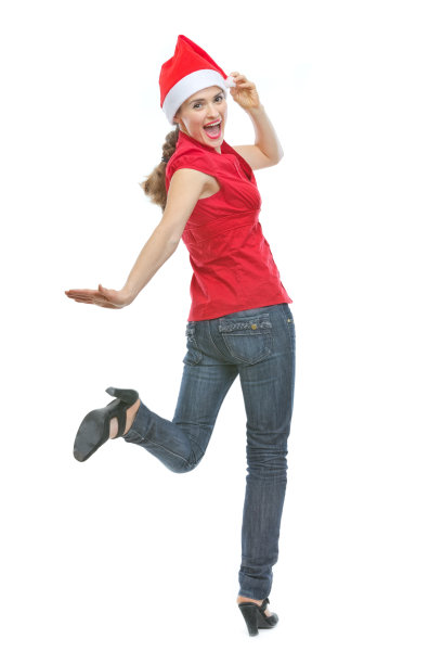 微笑的女孩在圣诞帽滑稽摆姿势白色图片下载