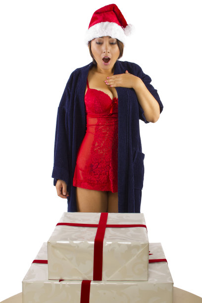 性感的亚洲女人在内衣醒来的圣诞礼物图片下载