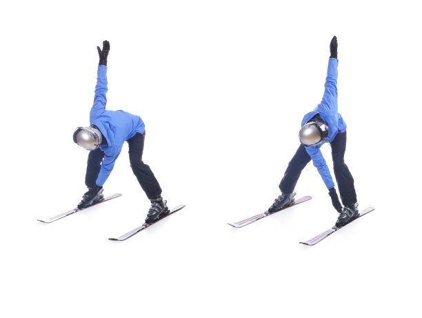 滑雪者演示滑雪的热身运动。风车。图片下载