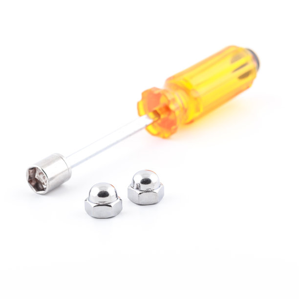 螺丝刀和六角圆帽螺母。图片下载