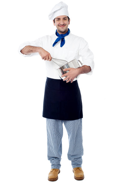 兴高采烈的厨师在厨房里搅拌面糊图片下载