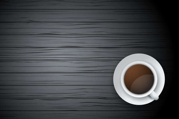 一杯咖啡或茶放在桌子上深色的木头上图片下载