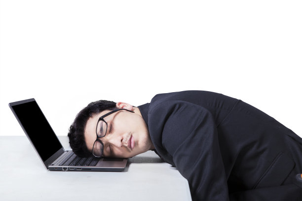 男经理睡在笔记本电脑上图片下载