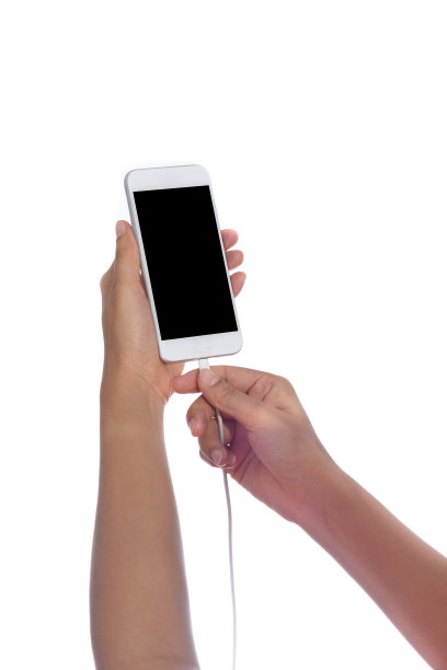 智能手机与空白屏幕和充电器在手孤立图片下载