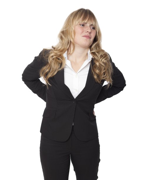 背部疼痛的年轻女商人图片下载