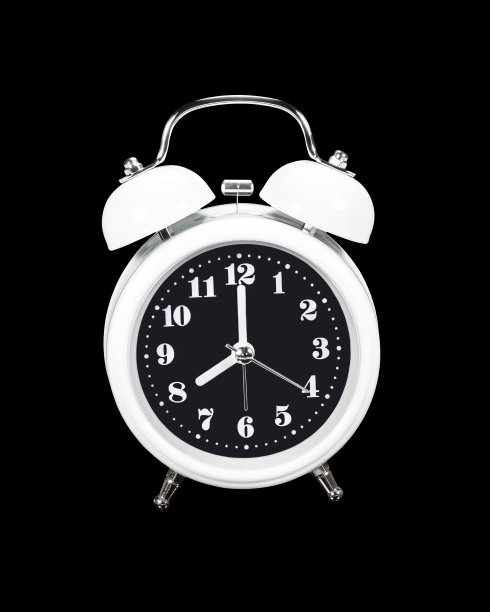 白色闹钟隔离在黑色上图片下载