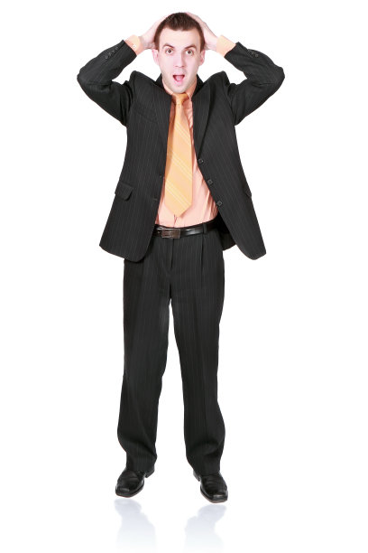 商人在恐怖的情况下抱着头。图片下载