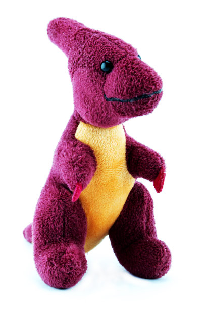 白色背景上的恐龙娃娃。图片下载