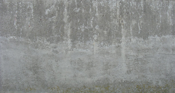 破旧的混凝土墙上有浅灰色的波浪状泥土图片下载