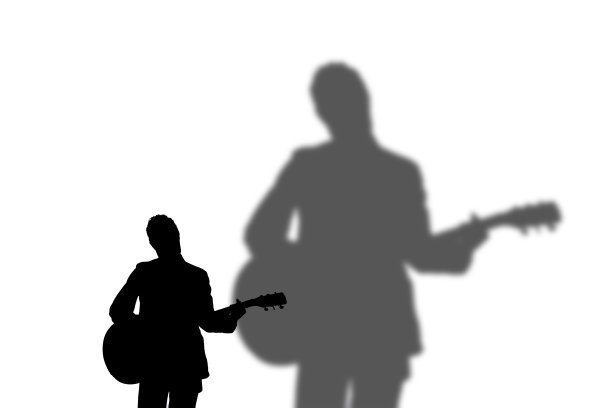 吉他手的剪影在白色的背景图片下载