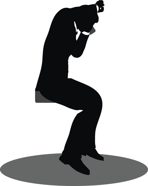 商务人士坐在电话旁剪影图片下载