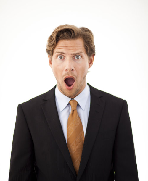 震惊的商人看着相机图片下载